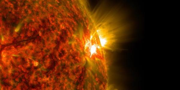 An active region on the sun emits a solar flare